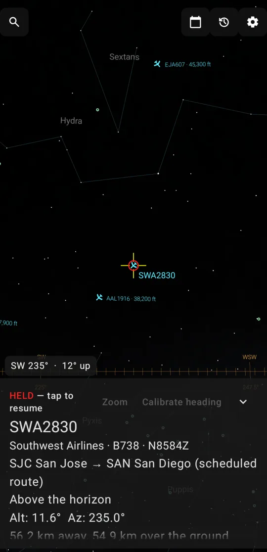 An aircraft held in the reticle, with its flight number, airline, route and altitude